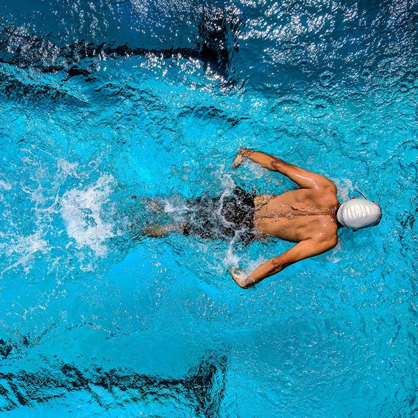 Swimmer using Swim Plugs